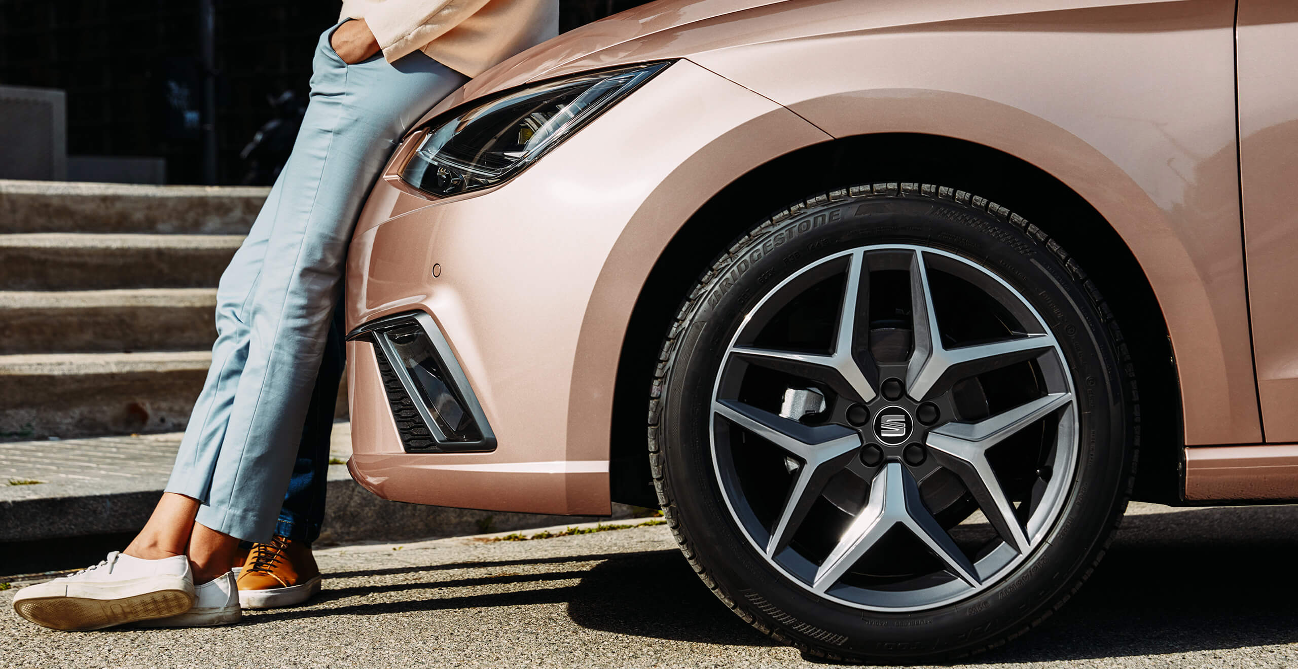 SEAT new car services maintenance mot checks – woman leaning against SEAT car rose gold 